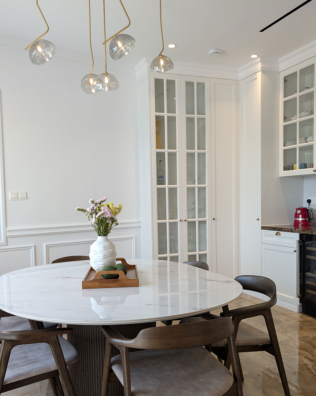 Dining area with glass pendant lights