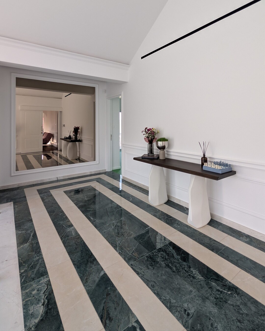 Entrance with green and cream striped stone floor